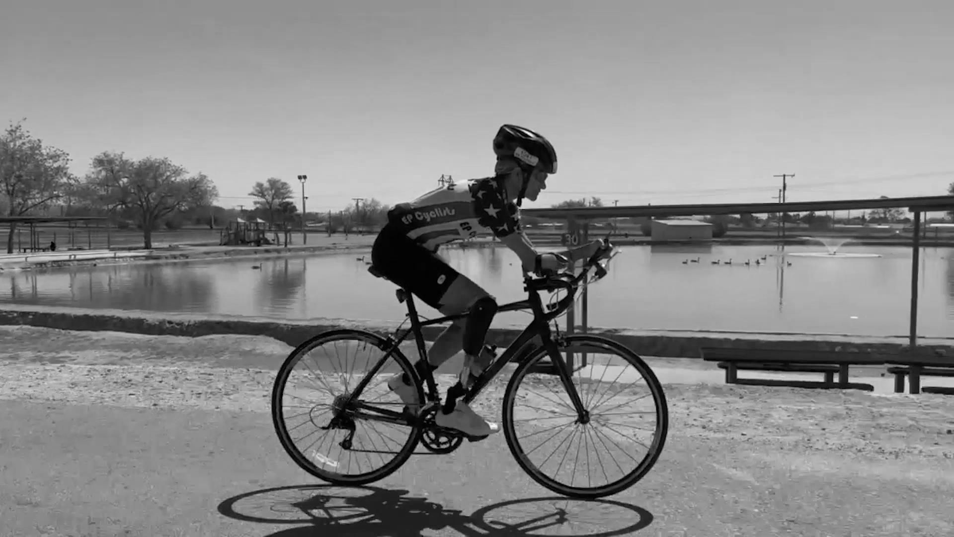 Young man riding a bicyle.