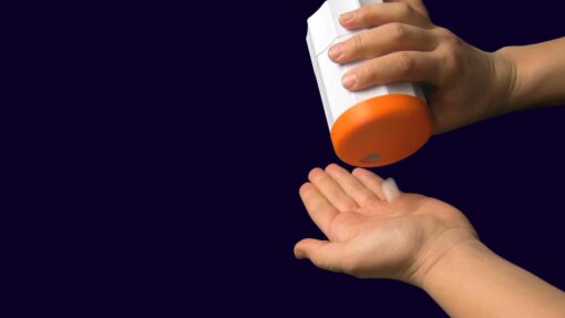 A person demonstrating the use of a 3D Printed assistive device that was created by a Make:able user. Make:able is an annual assistive technology challenge for students and anyone with an interest in design for disability.