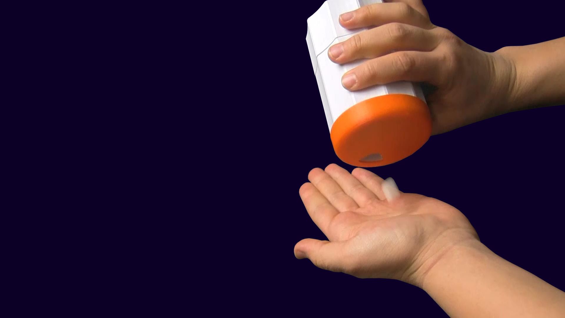 A person demonstrating the use of a 3D Printed assistive device that was created by a Make:able user. Make:able is an annual assistive technology challenge for students and anyone with an interest in design for disability.